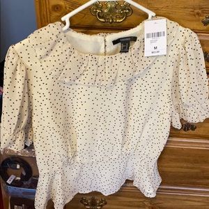 Woven top , cream with black dots . Size M